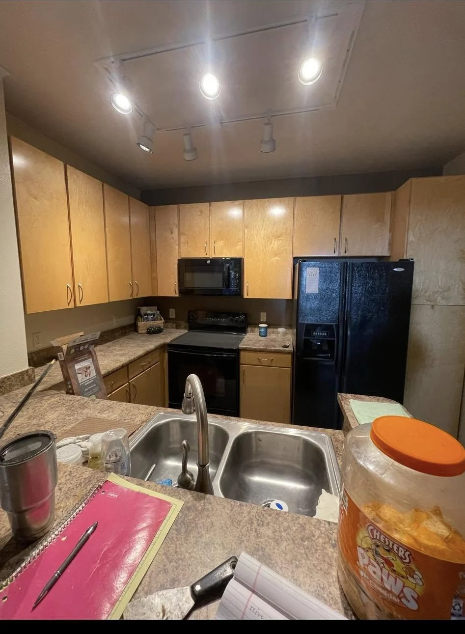 The same kitchen before refinishing, with tan cabinet fronts